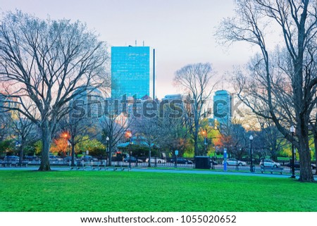 Skyline and Boston Common public park of downtown Boston, Massachusetts, the United States. People on the background. Late in the evening