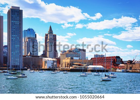 Motorboats and Long Wharf with Customhouse Block, Skyscrapers of Custom House and Financial District of Boston, MA, United States.
