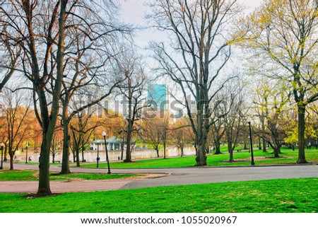 Skyline and Boston Common public park at downtown Boston, Massachusetts, the United States. People on the background. Late in the evening