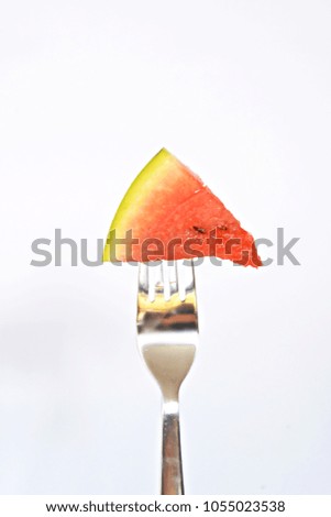 piece of watermelon on a fork