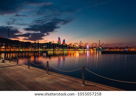 Baku city boulevard and Caspian sea in evening lights after sunset Royalty-Free Stock Photo #1055057258