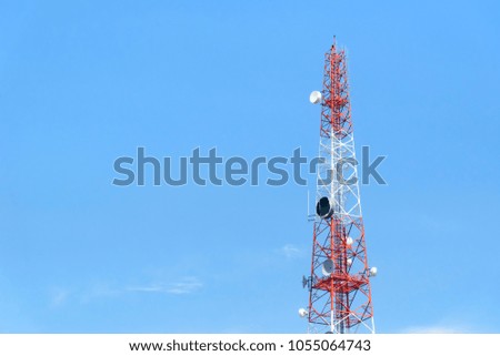 The telecommunication tower with the blue sky.
