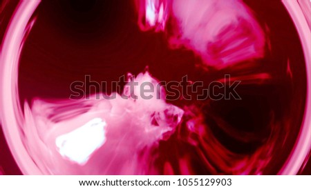 Rainbow red smoke flowing in a circle black. Smoke in circular motion. Separated on pure black background