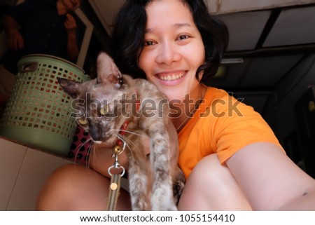 Asian woman selfie with kitten