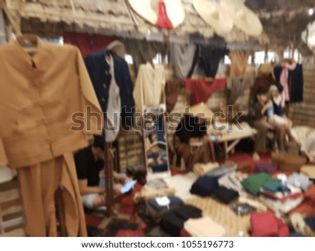People are selling clothes from North of Thailand style. It's blurred picture.