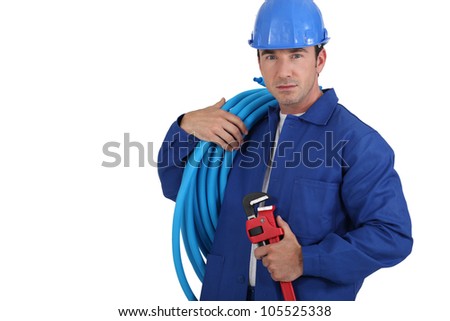 Workers with blue tube roll