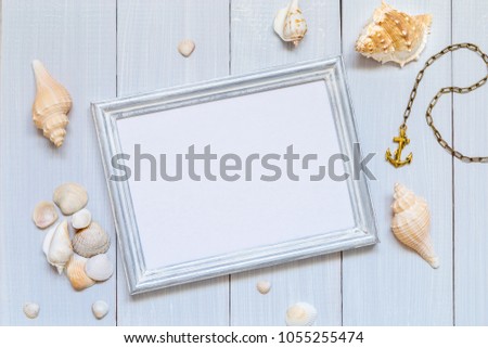 Blue wooden background with seashells. Copy Space for text.
