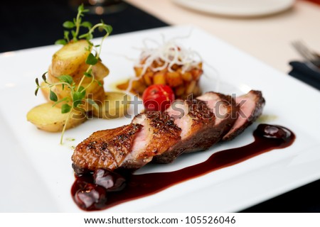 Roasted duck with pear,marinated in red wine and mascarpone rose