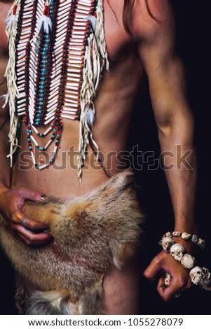 young man in Indian breastplate 