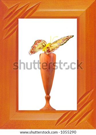 The butterfly on a wooden wine-glass in a framework