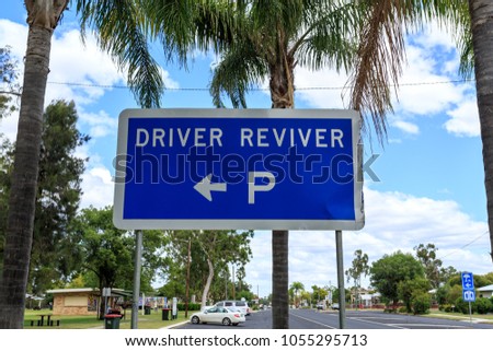 Sign indicating the location of a Driver Reviver site in Inglewood, Queensland, Australia. The site provides free tea, coffee and biscuits, toilet facilities, shade, seating and water.