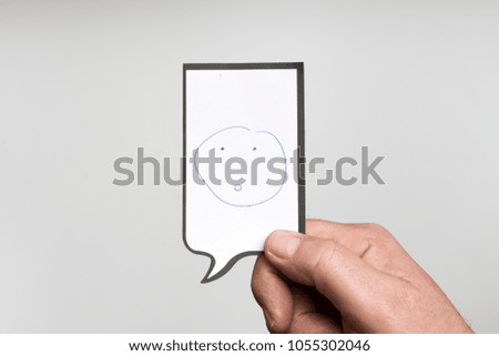 a white piece of paper with the drawing of an amazed face