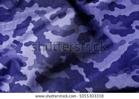 Military uniform pattern in blue tone. Abstract background and texture.