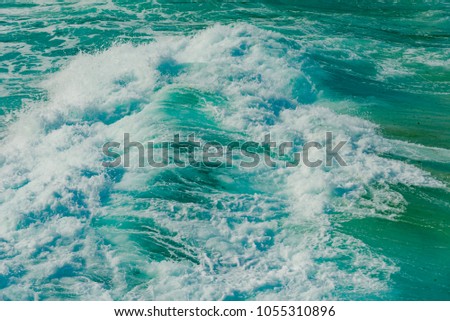 
waves on the Atlantic ocean in the rocky coast of the Caribbean sea in the Aruba island of the Netherlands Antilles
