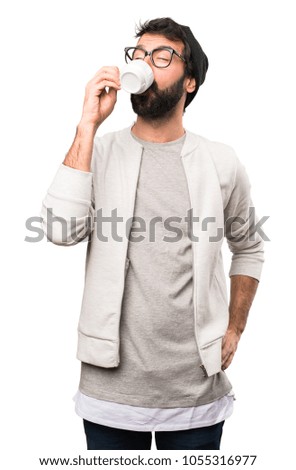 Hipster man holding a cup of coffee on white background