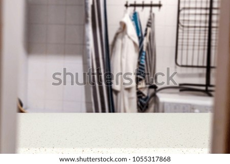 Table background of free space for your product and blurred background of bathroom. 