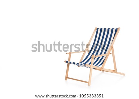 one striped beach chair, isolated on white Royalty-Free Stock Photo #1055333351