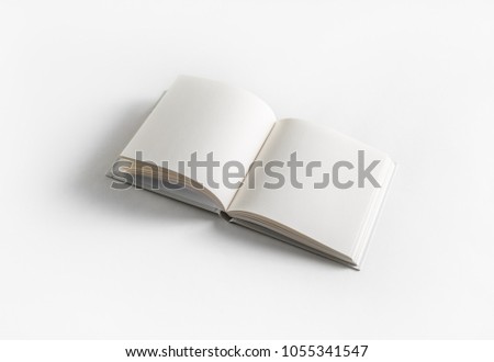 Blank opened book on white paper background. Template for graphic designers portfolios.