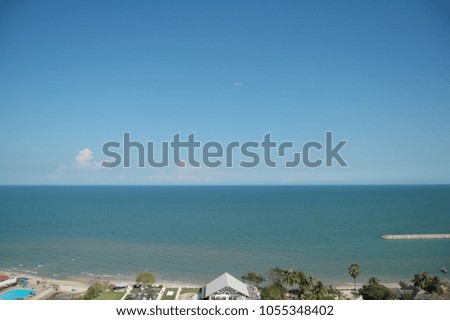 The beautiful sky view of the beach in thailand. with a helicopter in the middle of photo. 