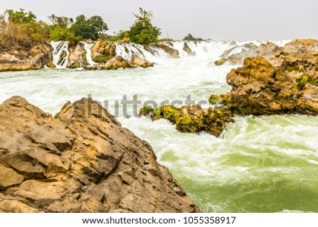 Beautiful view of waterfall landscape. Small waterfall in deep green forest scenery