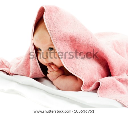 child under pink blanket