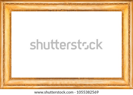 Gold wooden frame with carved ornament. Isolated on white