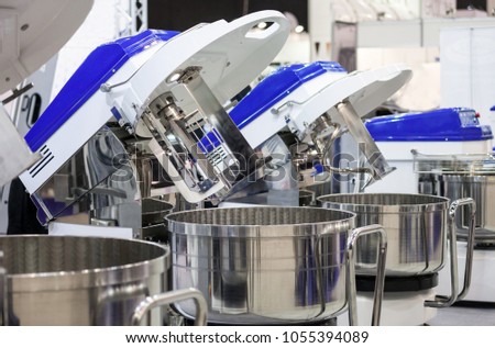 Machines in food factory, confectionery industry Royalty-Free Stock Photo #1055394089