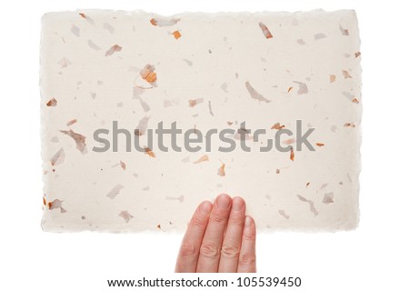 Handmade paper in woman hand isolated on white background