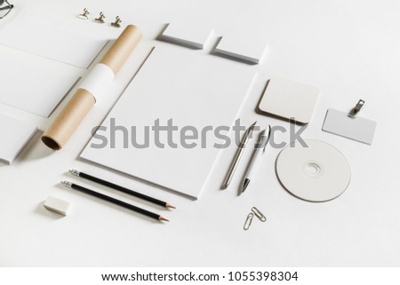 Photo of blank stationery set on white paper background. Corporate identity mockup. Responsive design template. Royalty-Free Stock Photo #1055398304