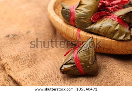 Rice dumplings on basket with gunny background
