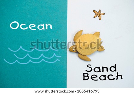 wooden turtle on white and green background with text ocean and sand beach 