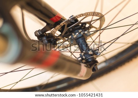 View of the bicycle bushing through spokes, bicycle parts close-up