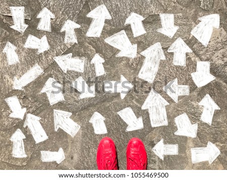 One standing on the road to future life with many directions arrows sign in different ways, decision making
