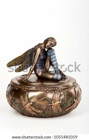 metal jewelry box with decorative figure Tinkerbell on white background