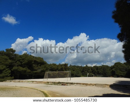Photo of Greek outdoor playground with beautiful scattered clouds and blue sky