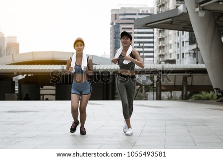 fitness, sport, people and lifestyle concept - happy couple running outdoors.