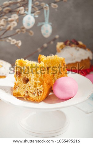 Easter cake and colorful eggs on festive Easter table 
