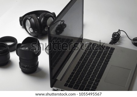 organization of photographic material and editing with computer on work table