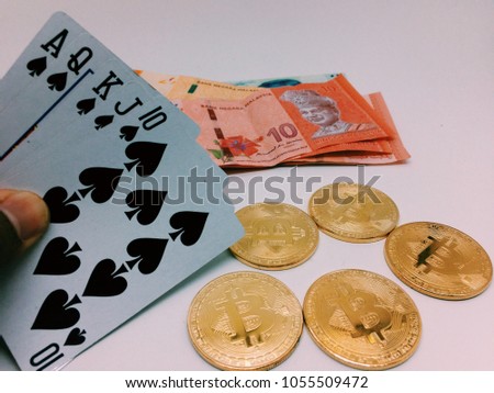 Bitcoin is a trending in a financial world with a playing card that show royal flush
