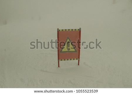 Danger sign on ski track photo shoot