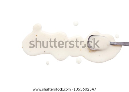 splashes and spilled ranch dressing with a spoon.  isolated on white background. flat lay, top view Royalty-Free Stock Photo #1055602547
