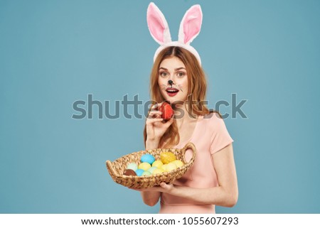  young woman in a hare costume with Easter eggs, holiday, spring, religion, fasting, April                             