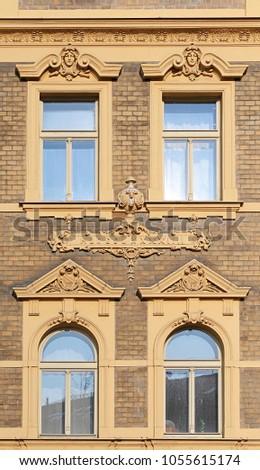 Fragment of the facade of an old building in the background photo. Window. Prague, 2018.