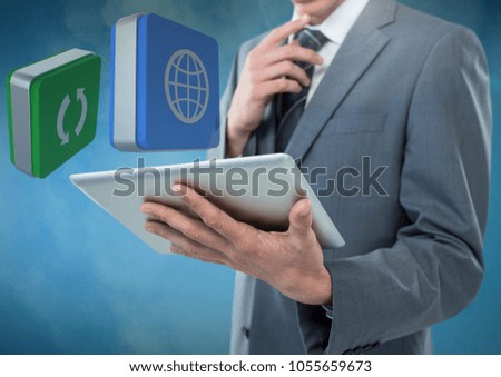 Digital composite of Businessman holding tablet with apps icons against blue foggy background