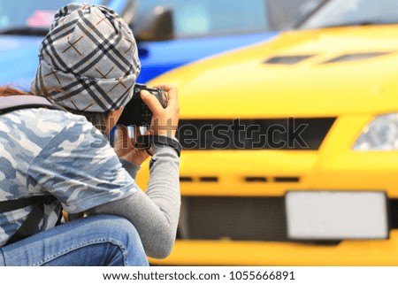 Photographer taking picture of the car