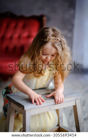  Little princess pretty girl  playing.little girl in  dress in vintage room .little girl playing near mirror