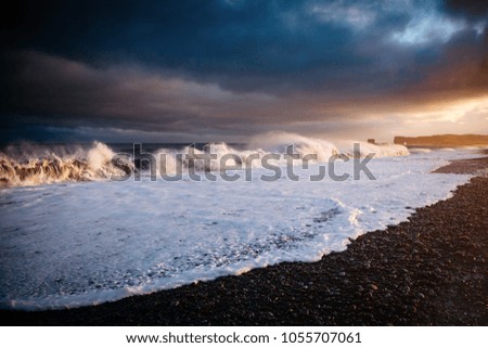 Epic view of Reynisfjara beach and sunny waves. Location cape Dyrholaey, Atlantic ocean near Vik village, Iceland, Europe. Scenic image of beautiful nature landscape. Discover the beauty of earth.
