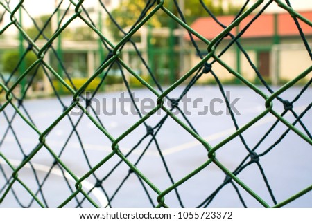 Green metal net is used as a through fence. It can prevent intruder but gives the look-through view.