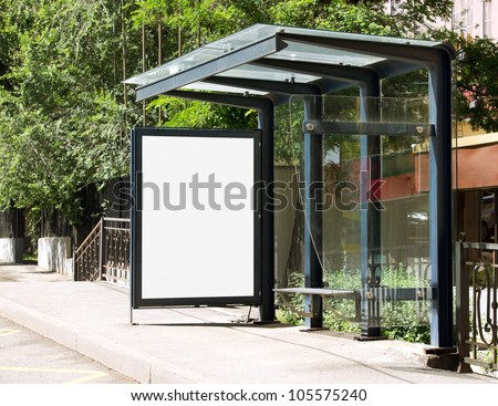 Blank Billboard on Bus Stop for your advertising situated (with work path) Royalty-Free Stock Photo #105575240