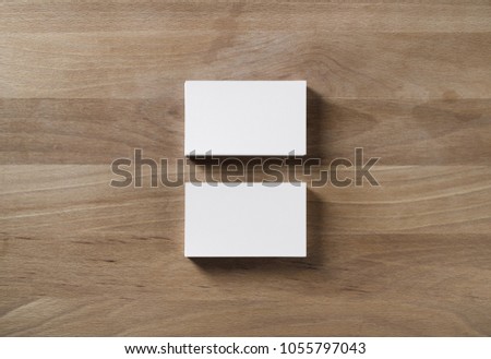 Two blank horizontal business cards on wooden table background. Flat lay.